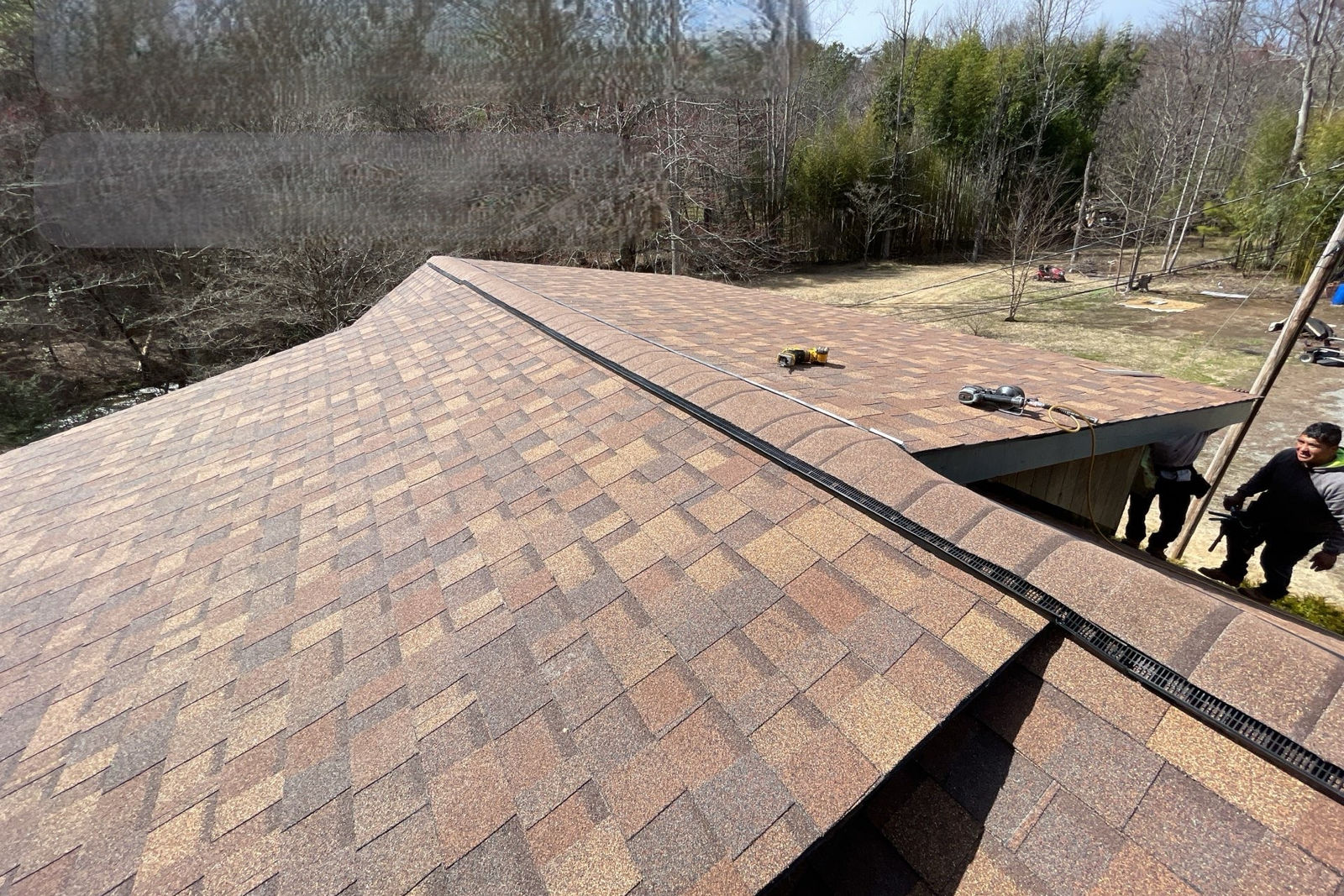 Freedom Roofing & Exteriors crew at work on a roof